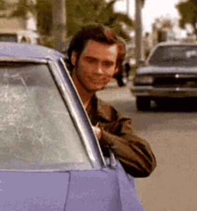 Man Peeking Out Of Purple Car Window GIF