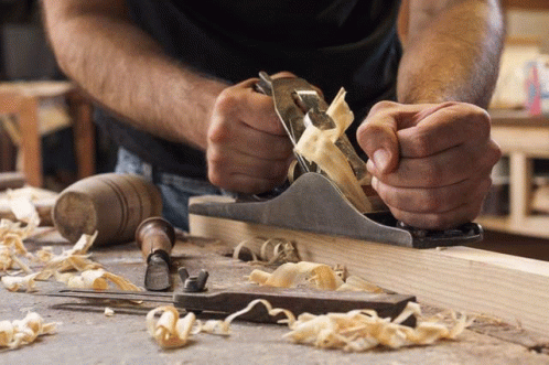 Man Planing Wood With Plane GIF