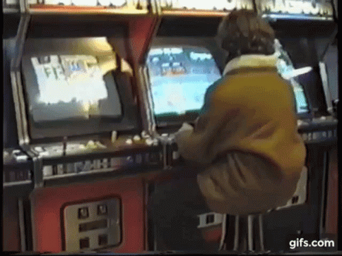 Man Playing Arcade Game GIF