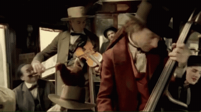 Man Playing Bagpipe In Front Of Crowd GIF