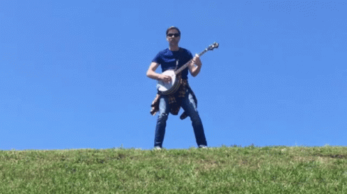 Man Playing Banjo On A Hill GIF