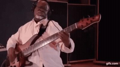 Man Playing Bass Guitar With Headphones GIF