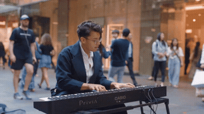 Man Playing Casio Privia Keyboard On City Street GIF