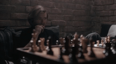 Man Playing Chess On Couch GIF