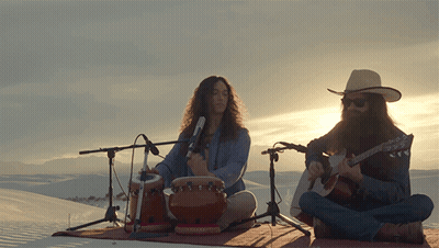 Man Playing Drum And Guitar In Front Of Microphones GIF