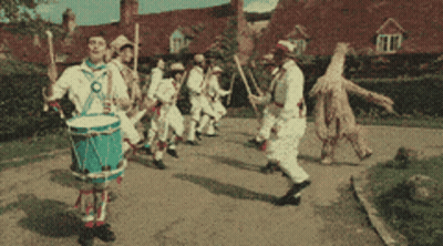 Man Playing Drum In Parade GIF