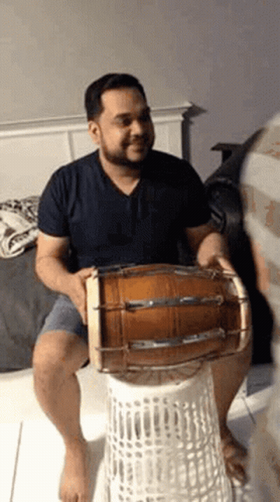Man Playing Drum On Laundry Basket GIF