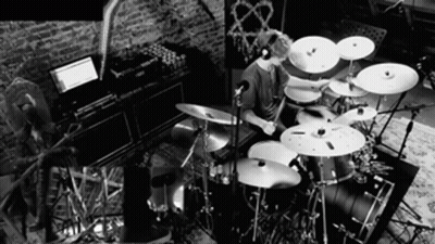 Man Playing Drum Set Black And White GIF