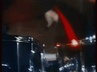 Man Playing Drum Set In Dark Room GIF