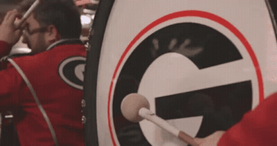 Man Playing Drum With Letter G GIF