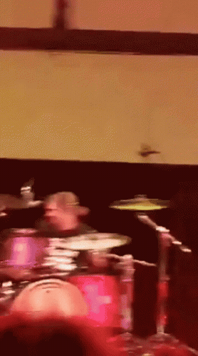 Man Playing Drums In Dark Room GIF