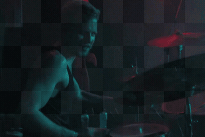 Man Playing Drums In Dark Room GIF