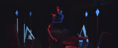 Man Playing Drums In Dark Room With Lights GIF