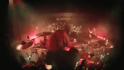 Man Playing Drums In Front Of Crowd GIF