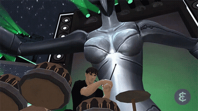 Man Playing Drums In Front Of Large Robot GIF