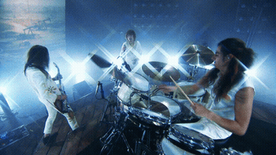 Man Playing Drums In Front Of Painting GIF