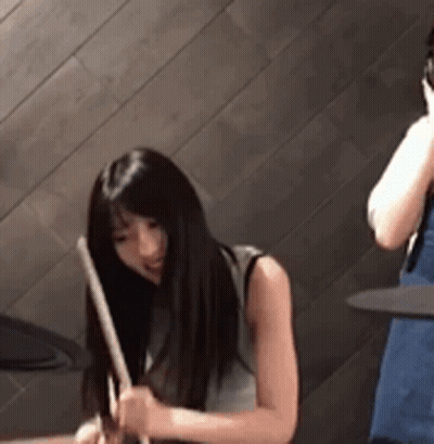 Man Playing Drums In Front Of Sunburn Advertisement GIF