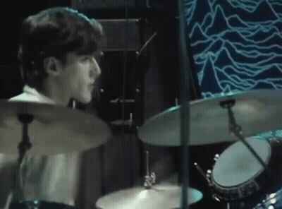 Man Playing Drums On Blue Stage GIF