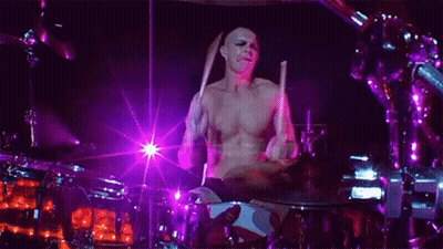 Man Playing Drums On Stage GIF