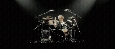 Man Playing Drums On Stage GIF