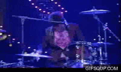 Man Playing Drums On Stage GIF