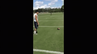 Man Playing Football On Field With Goal Post GIF