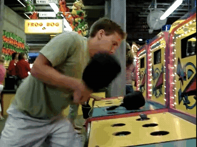 Man Playing Frog Dog at Carnival