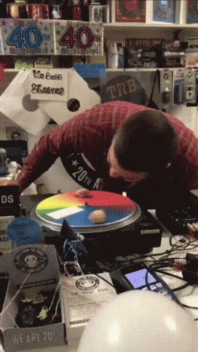 Man Playing Game In Front Of 40 Sign GIF