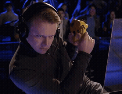 Man Playing Game With Headphones And Yellow Controller GIF