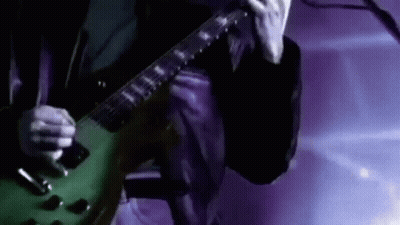 Man Playing Green Electric Guitar GIF
