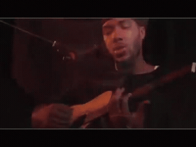 Man Playing Guitar And Singing Into Mic GIF