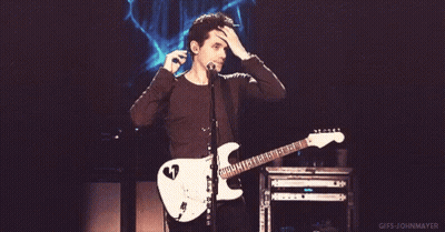 Man Playing Guitar And Singing Into Microphone GIF