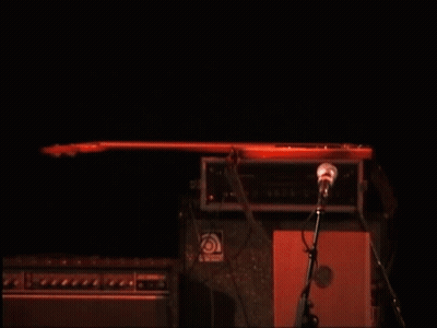 Man Playing Guitar And Singing Into Microphone GIF