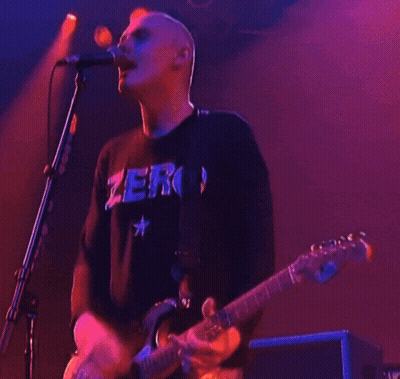 Man Playing Guitar And Singing With Zero Shirt GIF