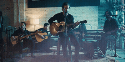 Man Playing Guitar At Microphone GIF