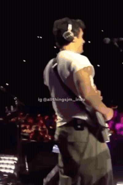 Man Playing Guitar In Black Camp Lion Shirt GIF