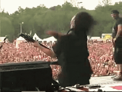 Man Playing Guitar In Front Of Crowd GIF