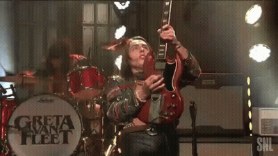 Man Playing Guitar In Front Of Greta Van Fleet GIF