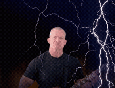 Man Playing Guitar In Front Of Lightning Strike GIF