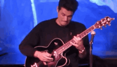 Man Playing Guitar In Front Of Microphone GIF