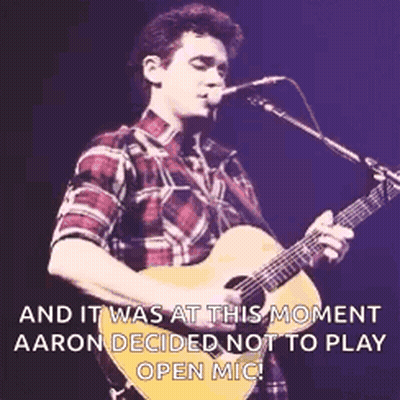Man Playing Guitar In Front Of Microphone GIF