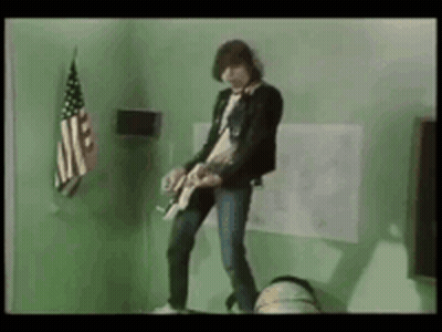 Man Playing Guitar Near American Flag GIF