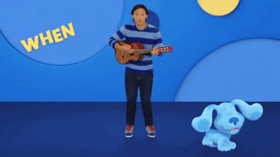 Man Playing Guitar Next To Stuffed Blue Dog Saying When GIF