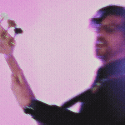 Man Playing Guitar On Pink Background GIF