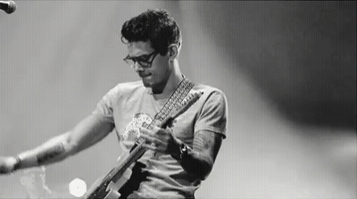 Man Playing Guitar On Stage Black And White GIF
