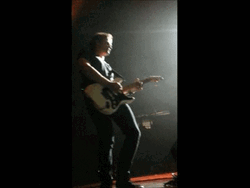 Man Playing Guitar On Stage