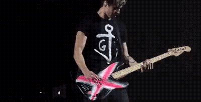 Man Playing Guitar On Stage Saying G GIF