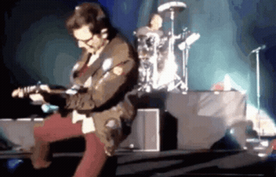 Man Playing Guitar On Stage With Drummer GIF