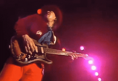 Man Playing Guitar On Stage With Pink Lights GIF