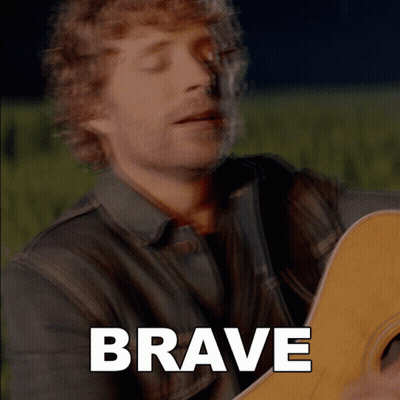 Man Playing Guitar Saying Brave